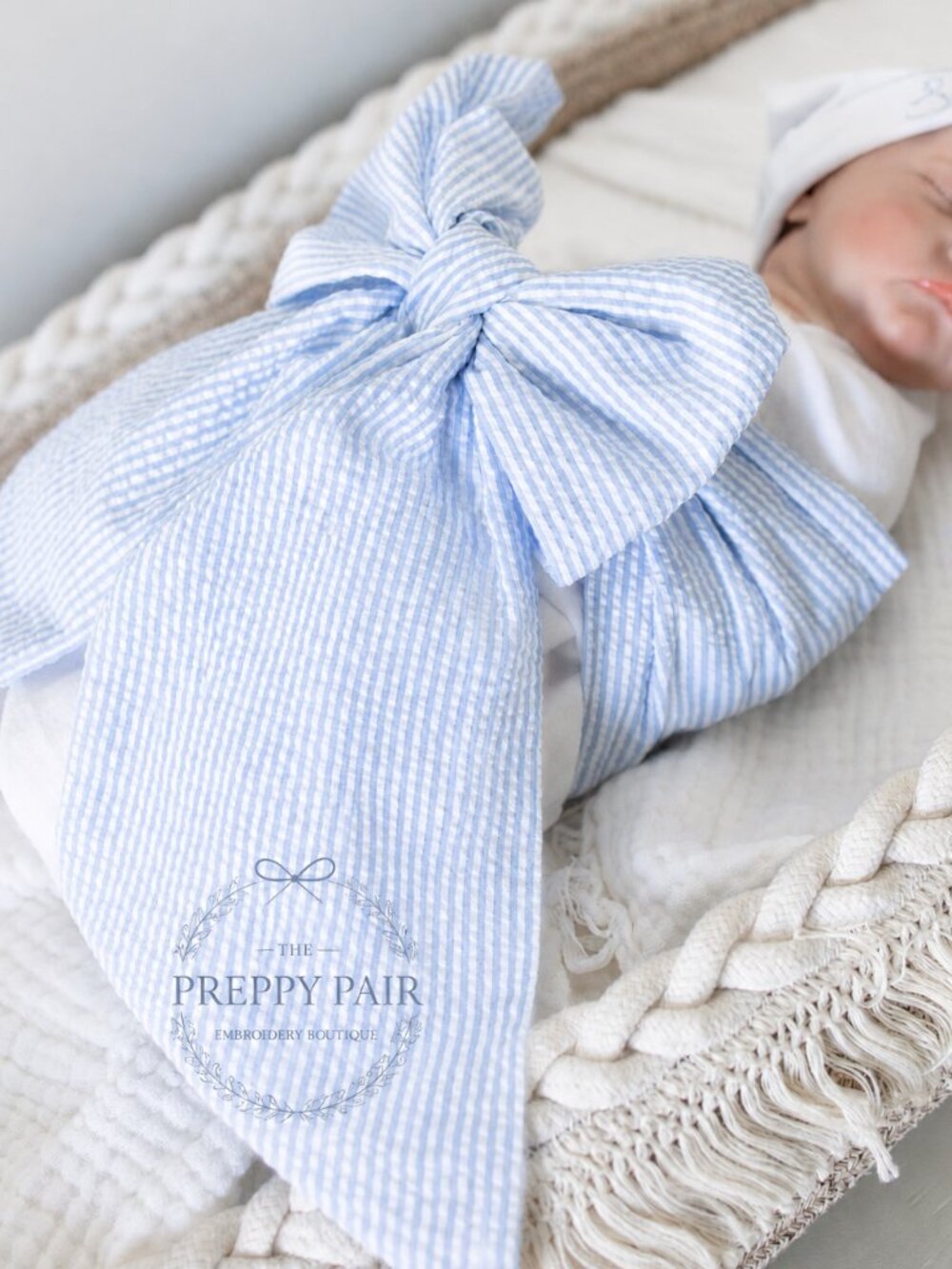 Blue Seersucker Baby Bow Sash to tie around newborn baby in swaddle